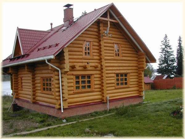 Как выполняется покраска деревянного дома - фото